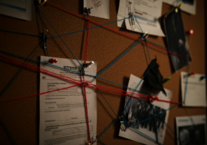 Board of evidence interlinked with strings.